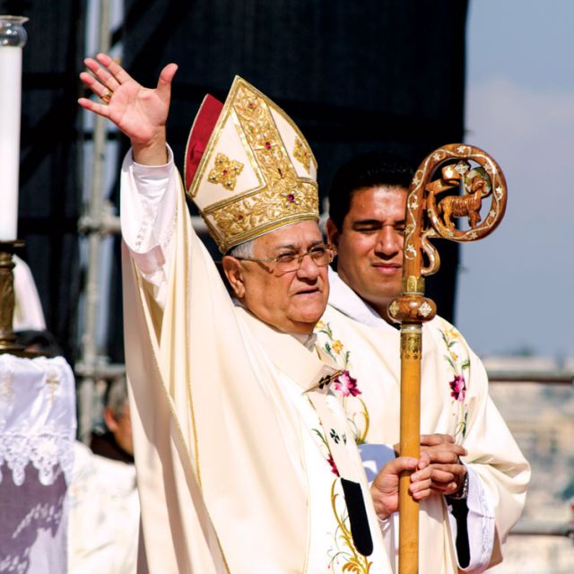 Archbishop Fouad Tawl, the Latin Patriarch of Jerusalem, waves to the more than 6,000 parishioners, welcoming them to a special Mass to mark the start of the final week of the Year of Faith.