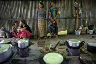 Ethnic Kachin refugees are seen inside a shared kitchen at a camp in Myitkyina, Myanmar, July 30. 