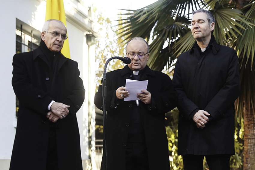 Archbishop Charles Scicluna of Malta speaks during a press conference accompanied in Santiago, Chile, June 12. He is accompanied by Father Jordi Bertomeu Farnos, right, an official of the Vatican&#039;s doctrinal congregation. 