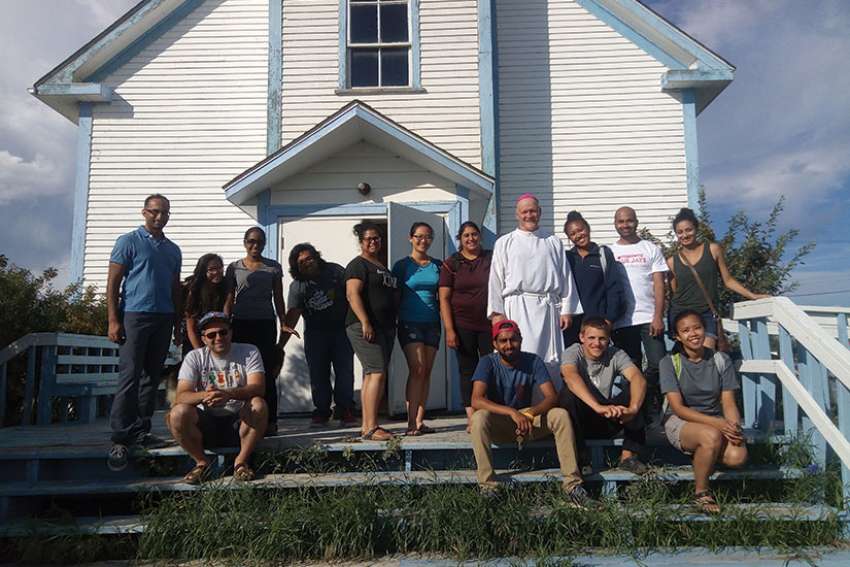 Bishop Mark Hagemoen with his crew of helpers, including his OCY visitors from the south.