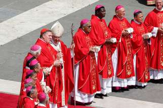 Pope Francis talks with Cardinal Joseph W. Tobin of Newark, N.J., as he stands with archbishops at the conclusion of a Mass marking the feast of Sts. Peter and Paul in St. Peter&#039;s Square at the Vatican June 29. New archbishops from around the world received their palliums from the pope. The actual imposition of the pallium will take place in the archbishop&#039;s archdiocese.