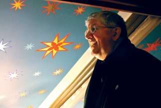 Cardinal Thomas Collins inspects St. Michael&#039;s Cathedral&#039;s newly renovated ceiling in 2016.