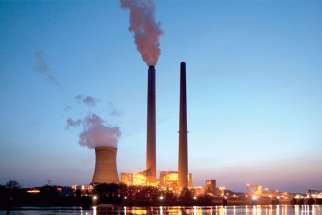 Smoke billows from the American Electric Power’s coal-fired Mountaineer Power Plan in New Haven, W.Va. Development and Peace has launched its fall campaign to combat climate change.