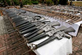 A file photo shows seized firearms in Manila, Philippines. Philippine church leaders have joined rights organizations to denounce and call for an investigation into the killing of nine activists by security forces in raids in four Philippine provinces March 7, 2021 that authorities said were tied to illegal activity.