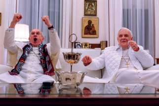 Jonathan Pryce as Pope Francis  and Anthony Hopkins as Pope Benedict in a scene from The Two Popes.