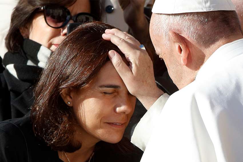Pope Francis blesses a woman during his general audience in St. Peter&#039;s Square at the Vatican Nov. 21. 