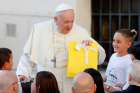 Pope Francis receives a gift from children during his general audience in St. Peter&#039;s Square at the Vatican Sept. 11, 2019.