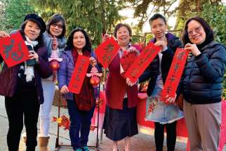 Members of Our Lady of Fatima Parish in Coquitlam, B.C., hold their creations for the Lunar New Year celebration, held Feb. 5.