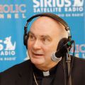 U.S. Cardinal John P. Foley, died Dec. 11 in Darby, Pa., after a battle with leukemia. He was 76. He is pictured on air with Sirius Satellite Radio during the 2007 Catholic Media Convention in New York.
