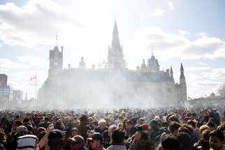 Smoke rises during the annual marijuana rally on Parliament Hill in Ottawa, Ontario, April 20. Msgr. Frank Leo, general secretary of the Canadian Conference of Catholic Bishops, says with the exception of cannabis use for medicinal purposes, consuming marijuana violates the virtue of temperance and should be avoided.