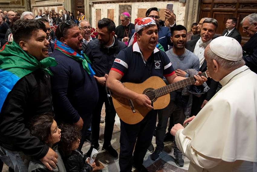 Pope Francis listens to men sing during a meeting with Italy&#039;s Roma, Sinti and Gypsy communities at the Vatican May 9, 2019. 