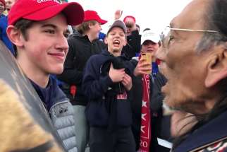Nick Sandmann, a junior at Covington Catholic High School in Park Hills, Ky., and others students from the school stand in front of Native American Nathan Phillips near the Lincoln Memorial in Washington in this still image from video Jan. 18, 2019. Sandmann filed a $250 million defamation lawsuit Feb. 19 against The Washington Post claiming the newspaper&#039;s coverage of the incident was biased.