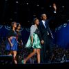 U.S. President Barack Obama walks on stage with first lady Michelle Obama and daughters Malia, left, and Sasha during his victory rally in Chicago Nov. 7. 