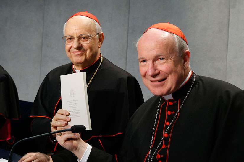 Cardinal Lorenzo Baldisseri, general secretary of the Synod of Bishops, and Austrian Cardinal Christoph Schonborn, holds a copy of Pope Francis&#039; apostolic exhortation on the family, &quot;Amoris Laetitia&quot; (&quot;The Joy of Love&quot;), during a news conference for the document&#039;s release at the Vatican April 8. The exhortation is the concluding document of the 2014 and 2015 synods of bishops on the family.