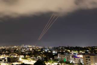 An anti-missile system operates after Iran launched drones and missiles towards Israel, as seen from Ashkelon, Israel, April 14, 2024.