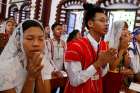 Young people pray as Pope Francis celebrates Mass with youths at St. Mary&#039;s Cathedral in Yangon, Myanmar, Nov. 30.