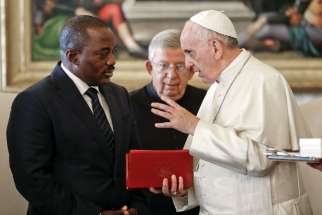 Pope Francis talks with Congolese President Joseph Kabila during a private audience at the Vatican Sept. 26. The Catholic church has pulled out of a national dialogue in Congo, after its president backed the postponement of elections a week after meeting the Pope.