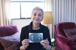 Nina Pickburn with a photo of her grandparents, who helped Fr. Gines Cespedes Gerez, a Spanish priest who was later killed during the Spanish Civil War.