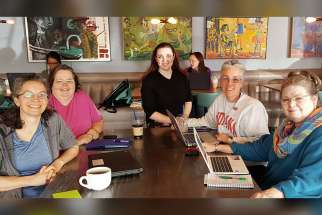 Sister Barbara Battista, a member of the Sisters of Providence of Saint Mary-of-the-Woods, Ind., second from right, participates in a planning meeting for the Wabash Valley March for Science in Terre Haute, Ind.