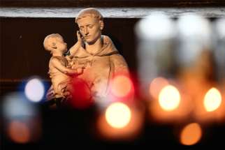 A statue of St. Anthony of Padua is displayed inside the Church of St. Sulpice in Paris Oct. 4, 2021. A new report on clergy sexual abuse in the Catholic Church in France estimates hundreds of thousands of victims since the 1950s.