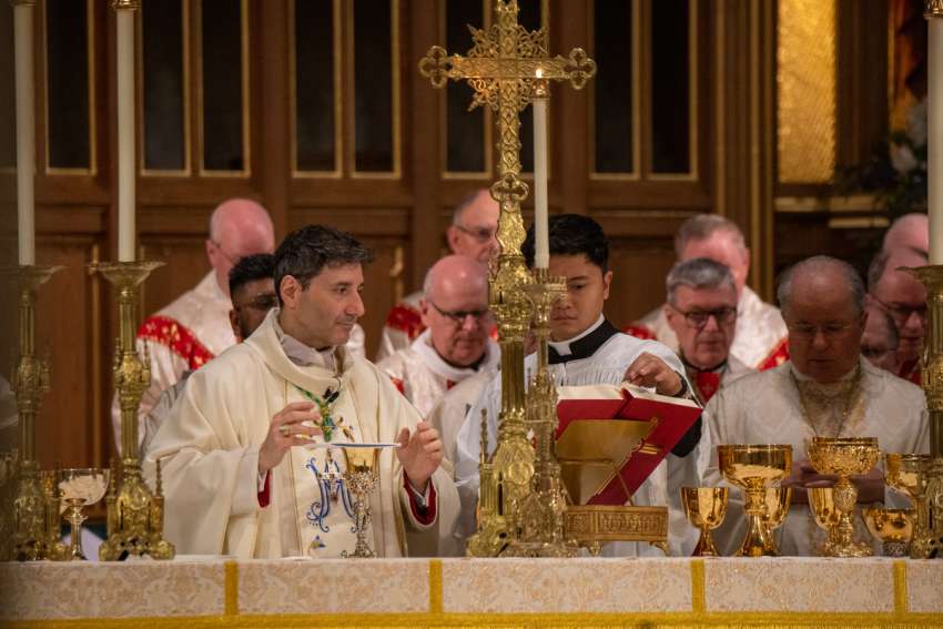 Francis Leo prays the Eucharistic Prayer in St. Michael&#039;s Cathedral at the his installation Mass as Archbishop of Toronto, March 25, 2023. 