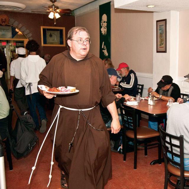 Br. Ken Cole, 49, is originally from Kitchener, Ont. He has been with the Capuchin Franciscans for five years and will take final, solemn vows next year. A former salesman, he came to realize he was meant for a life of service. Here he serves a meal at St. Francis’ Table in Toronto’s Parkdale area.