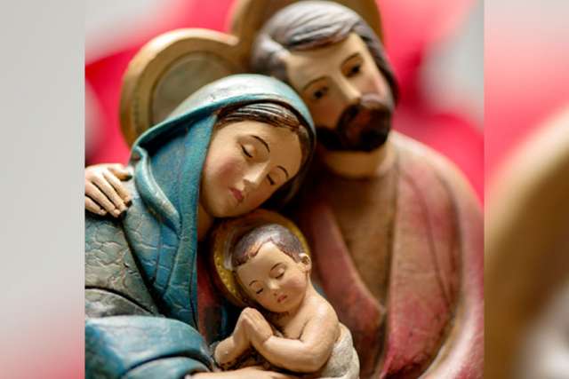 Mary, Joseph and the baby Jesus are depicted in a wooden creche at Sacred Heart Cathedral in Rochester, N.Y., in this Nov. 24 photo.