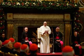 Pope Francis speaks during an audience to exchange Christmas greetings with members of the Roman Curia in Clementine Hall of the Apostolic Palace at the Vatican Dec. 22.