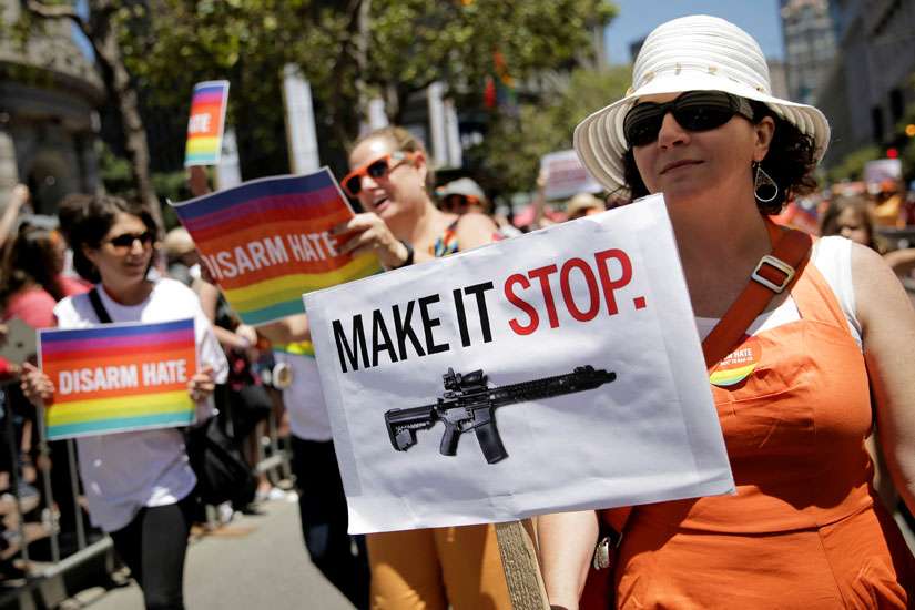 A woman holds a sign advocating for gun control while marching with Moms Demand Action at the gay pride parade in San Francisco June 26. In the first 180 days of 2016, there have been 163 mass shootings in the United States, according to data gathered by the Washington-based nonprofit Gun Violence Archive.
