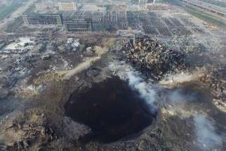 An Aug. 15 aerial view shows a large hole in the ground in the aftermath of an explosion that rocked the port city of Tianjin, China. The Aug. 12 blast engulfed an industrial area where toxic chemicals and gas were stored in the northeast Chinese port city. 