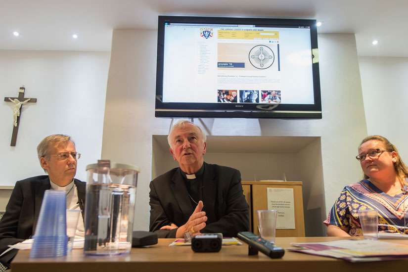 Auxiliary Bishop Nicholas Hudson of Westminster, Cardinal Vincent Nichols of Westminster and Clare Ward, home mission adviser of the Catholic Bishops&#039; Conference of England and Wales, address media July 7 in London about creating evangelization teams for every parish in England and Wales.