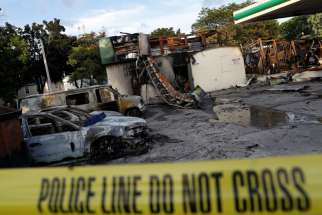 A gas station is seen Aug. 15 after it was burned down following the police shooting of a man in Milwaukee the previous day.