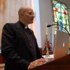 On a Wednesday afternoon, Fr. Mario Salvadori practises a homily, complete with his laptop and large screens.