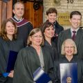 Michelle Griepsma (far left) stands with classmates, instructor Richard Shields and course manager Carol Devine (back row) following the convocation ceremony for the Certificate in Catholic School Governance program. 