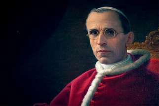 A painting of Pope Pius XII is displayed at The Catholic University of America in Washington May 25, 2021. A new book on the wartime pope still doesn’t clear up if he was a hero or villain of the Holocaust.