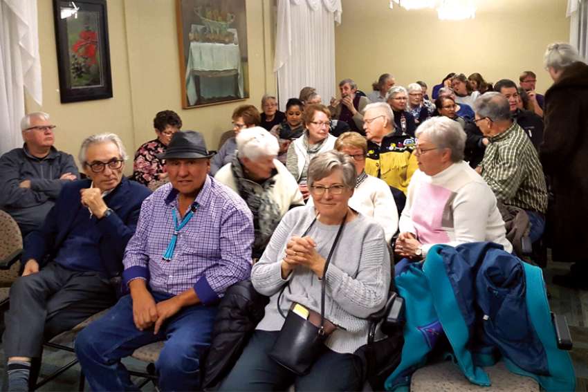 Phil Fontaine, former Grand Chief of the Assembly of First Nations, front row left, takes part in a Star of the North reconciliation event.