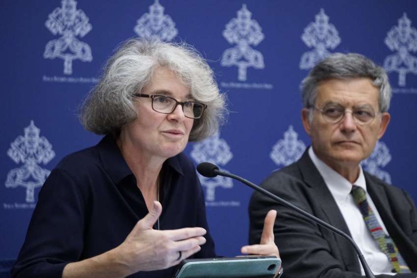 Xavière Missionary Sister Nathalie Becquart, undersecretary of the synod, responds to a question during a news conference at the Vatican Sept. 8, 2023. To the right is Paolo Ruffini, prefect of the Dicastery for Communication.