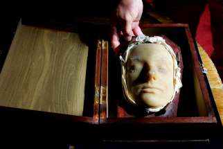 A wax death mask of Mary Queen of Scots, made in 1587 after her execution, is placed into its carrying case at Lyon and Turnbull auctioneers in Edinburgh, Scotland, Aug. 1, 2006. A set of golden rosary beads -- held by the Catholic Scottish queen when she was beheaded in London -- were reported stolen in 2021 from Arundel Castle, the ancestral home of the Catholic dukes of Norfolk.