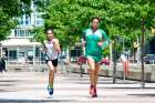 Michael Collins and his daughter runs into Ireland Park in Toronto, finishing the last lag of the Irish Diaspora Run.