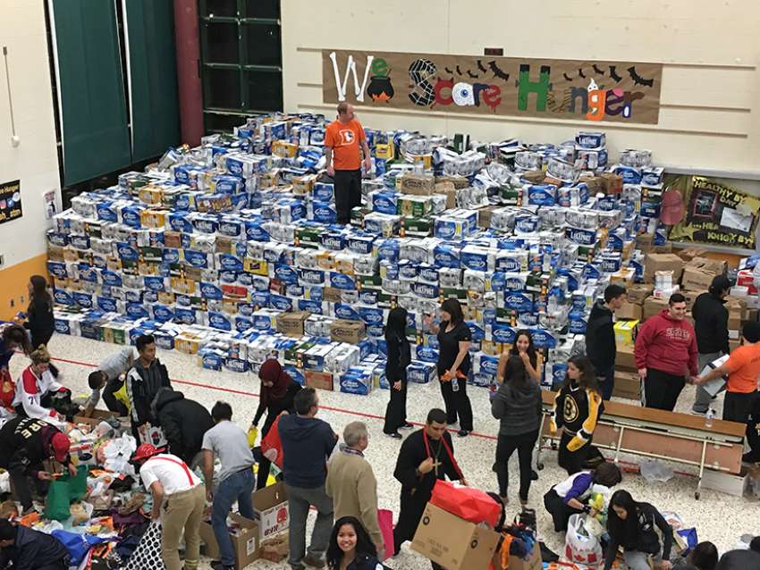 The gymnasium at St. Thomas More was packed with donated food items in donated beer cases last Halloween.