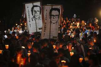 People participate in the &quot;little lanterns march&quot; at the Central American University in San Salvador during the 2015 commemoration of the 26th anniversary of the massacre of six Jesuit priests and two women, murdered in November 1989 by a military commando.