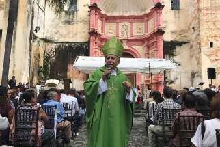 Bishop Ramon Castro Castro of Cuernavaca, Mexico, celebrates Mass Sept. 24 outside the city&#039;s cathedral, which dates to the 1500s and was badly damaged by the Sept. 19 earthquake in Mexico. 