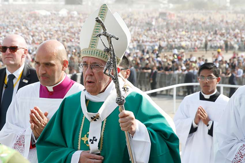 Pope Francis arrives in procession to celebrate Mass at Las Palmas Air Base in Lima, Peru, Jan. 21.