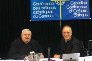 Msgr. Patrick Powers, left, and Archbishop Paul-Andre Durocher at last year’s CCCB plenary, held at Sainte-Anne-de-Beaupre.