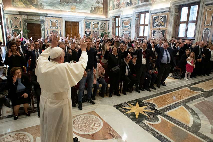 Pope Francis waves during a meeting with members of the Italian Federation of Associations for the Deaf at the Vatican April 25, 2019. 