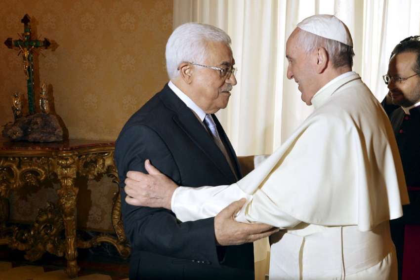 Pope Francis greets Palestinian President Mahmoud Abbas during a private audience at Vatican in 2015. Abbas is set to meet with the Pope again on Jan. 14.