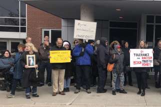 Parents gather at a public trustee meeting, April 24, 2023, to protest the remarks made by WCDSB trustee Wendy Ashby on social media.