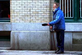 Elderly man seen begging in the ghetto downtown eastside area of Vancouver, B.C. Last month&#039;s multi-faith symposium talks centred around guaranteed basic income.