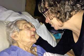 Carolynn Bilton comforts her mother Margie Harper in her final days in palliative care. 