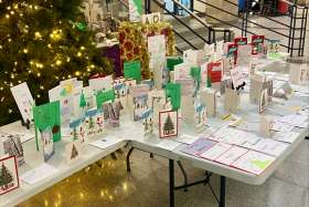 Displayed are hundreds of Christmas cards that will be sent to seniors who are isolated this Christmas season.